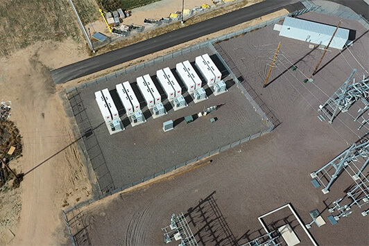 Aerial view of a battery energy storage system installed beside an electrical substation